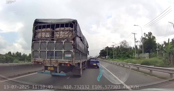 Xe tải chuyển làn ẩu kéo lê ôtô con Xe tải chuyển làn ẩu kéo lê ôtô con