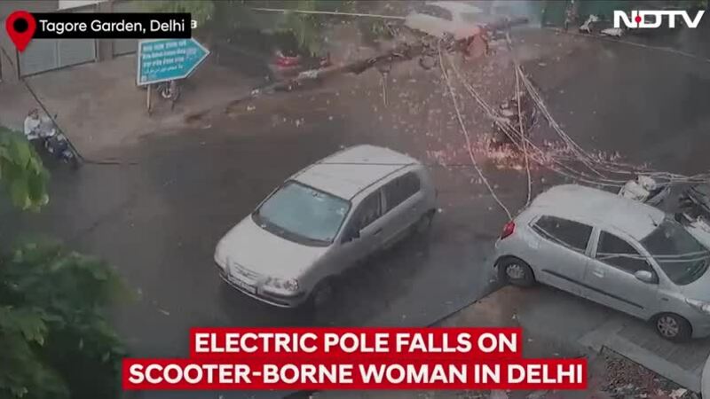 Cột điện đổ trùm kín dây điện lên người đi xe máy