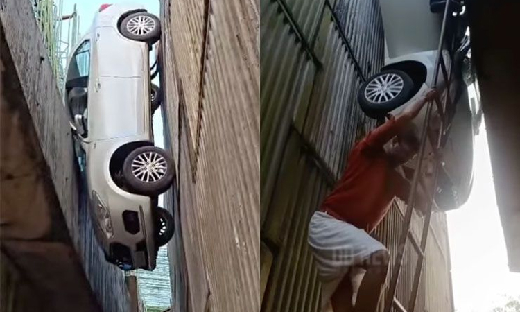 Ôtô rơi lọt giữa hai trụ cầu vượt đang xây